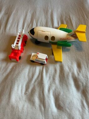 Vintage Fisher-Price Little People airplane and emergency vehicles.